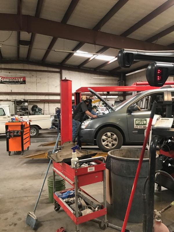 Shop interior with vehicles and tools